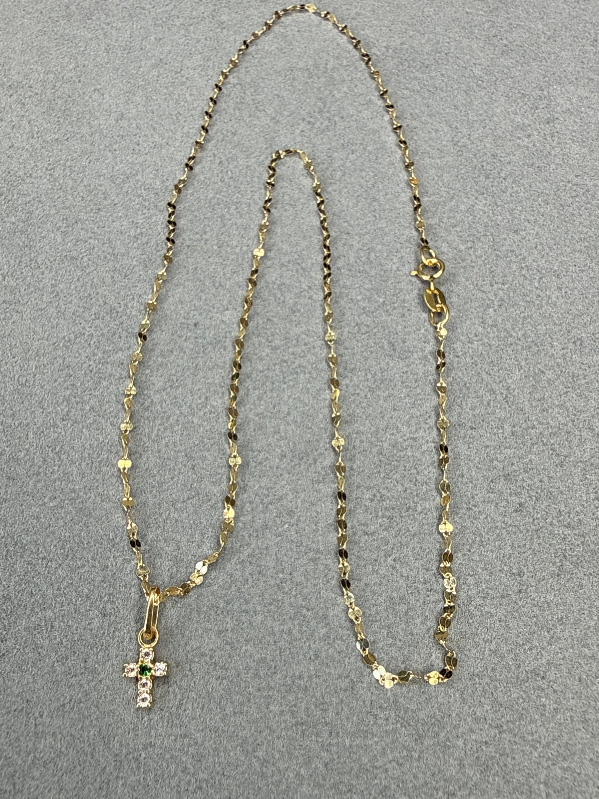 Dije mini cruz de circon blanco y verde Italiano 18k